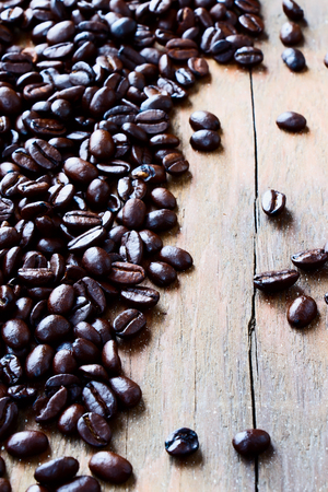 Coffee beans over wooden background.の写真素材