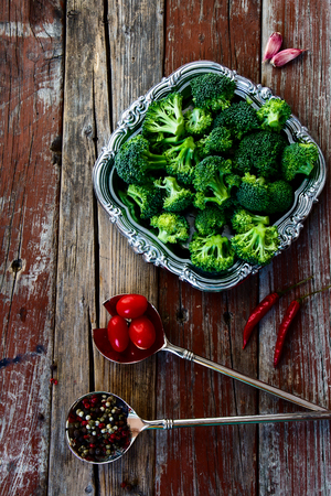 Top view of fresh green broccoli and Healthy Organic Vegetables on a Wooden Background.の写真素材