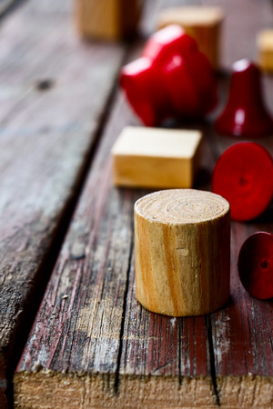 wooden geometric cubes over rustic wooden texture, selective focusの写真素材