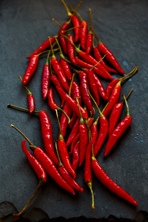 Red Hot Chili Peppers over dark grey background.の写真素材