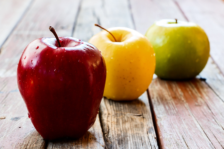 Fresh apples on rustic wooden background. Selective focus.の写真素材