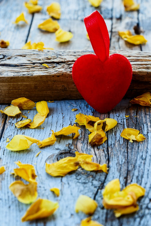 Red heart on vintage wooden backgroundの写真素材