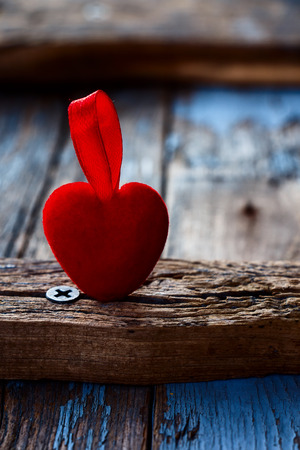 Valentines day red heart over old wooden board. Selective focus.の写真素材