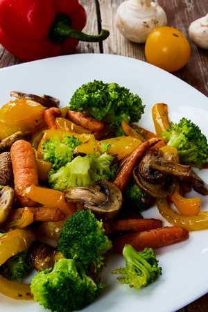 Grilled mix vegetables on rustic wooden background. Selective focus.の写真素材