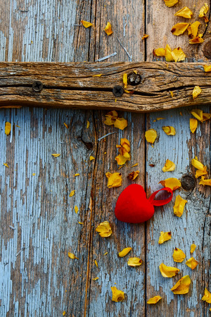Top view of red heart on vintage wooden background, shabby chic image for valentines or Christmas holiday season.の写真素材