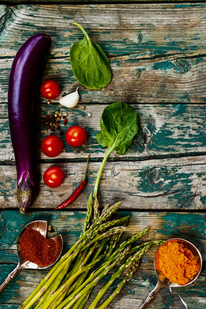 Organic vegetables and herbs on rustic Wooden Background.の写真素材