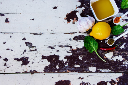 Food Elements and Spoon on old wooden background. Vegetarian food, health or cooking concept. Top view.の写真素材