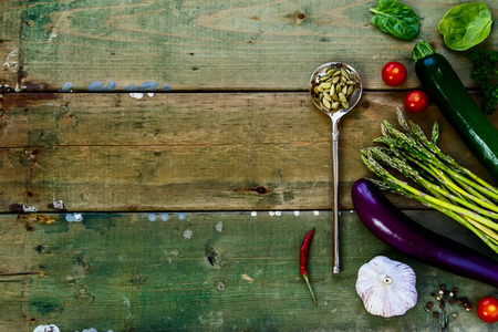 Spices and ingredients on old wooden background. Vegetarian food, health or cooking concept. Top view.の写真素材