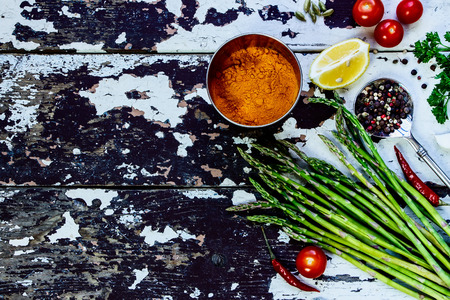 Healthy Bio Vegetables and spices - vintage spoon and old wooden backgroundの写真素材