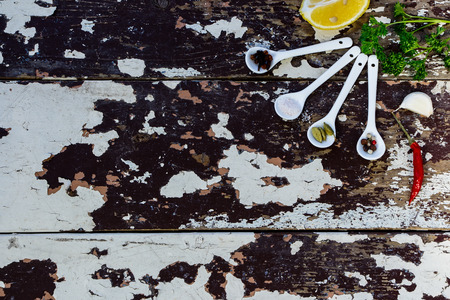 Herbs and spices selection over old wooden background - cooking, healthy eating. Food concept. Top view.の写真素材