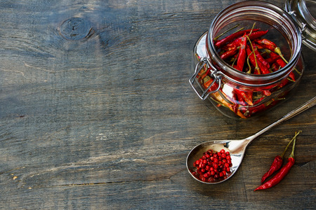 Red Hot Chili Peppers over wooden background.の写真素材