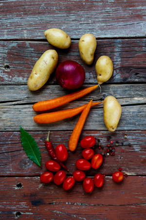 Top view of healthy organic vegetables on rustic wooden table. Food background. Healthy food from garden.の写真素材