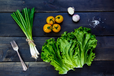 Ingredients for cooking on dark wooden background - healthy or vegetarian eating concept.の写真素材