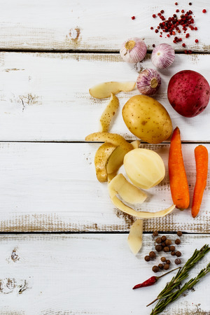 Top view of Healthy ingredients for cooking on white wooden background with space for text. Vegetarian food, health or cooking concept.の写真素材