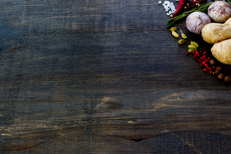 Herbs and spices selection on rustic wooden board. Cooking, food or health concept. Space for textの写真素材
