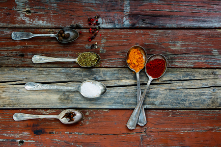 Rustic background with herbs and spices selection, close up. Cooking concept.の写真素材