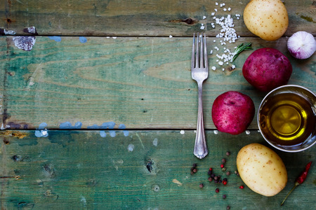 Potato preparation. Fresh organic vegetables. Food background. Healthy food from garden.の写真素材