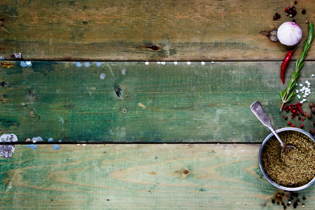 Food background with Spices. Herbs and spices selection - old metal cups and rustic wooden board. Cooking, food or health concept. Space for textの写真素材