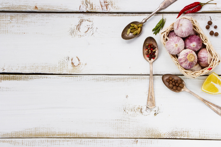Composition of Spices. Herbs and spices selection - old metal spoons and white wooden background. Cooking, food or health concept.の写真素材
