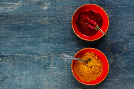 Spices turmeric and curry. Spice over dark wooden background with space for text. Cooking, food or health concept. Top view.の写真素材