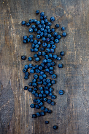 Blueberries on dark wooden Background. Summer or Spring Organic Fruits. Agriculture, Gardening, Harvest Conceptの写真素材