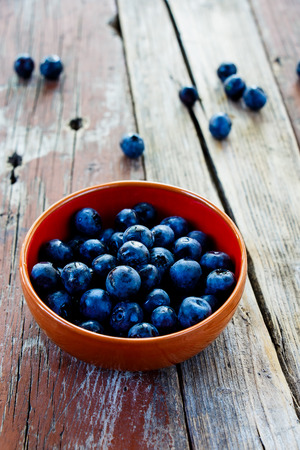 Fresh summer Blueberries on rustic wooden background. Sekective focus.の写真素材