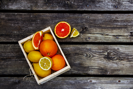 Food background with citrus fresh fruit over rustic wood. Top view.の写真素材