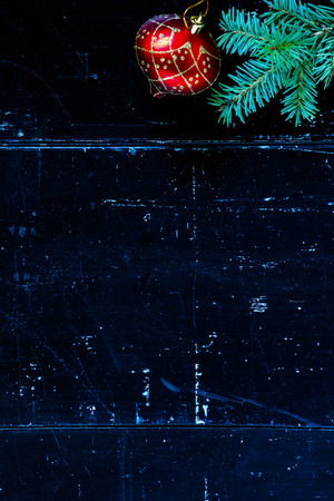 Branch of Christmas tree and ornament on vintage background. Holidays concept.の写真素材