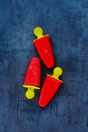 Top view of homemade strawberry ice cream sorbet on stone slate background, top view.の写真素材