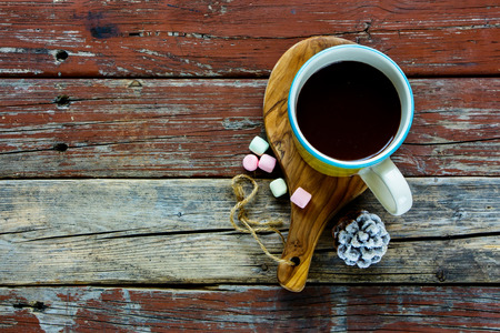Yellow cup of Hot chocolate with Marshmallows on rustic wooden background, top view, copy space, horizontal composition. Winter time. Holiday conceptの写真素材