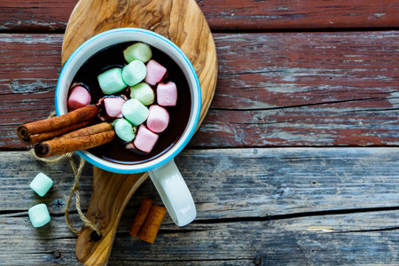 Close up of tasty Hot chocolate drink with Marshmallows on rustic wooden background, selective focus, copy space, top view. Winter time. Holiday conceptの写真素材