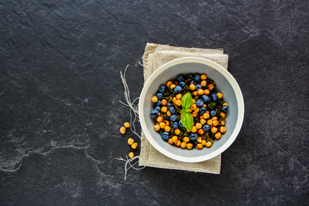 Vegan salad on black stone background flat lay.の写真素材