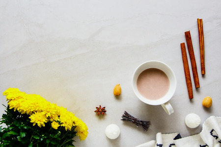 Autumn cozy composition flat lay. Hot chocolate, plaid, candle, fresh flowers. Autumn, fall concept.の写真素材