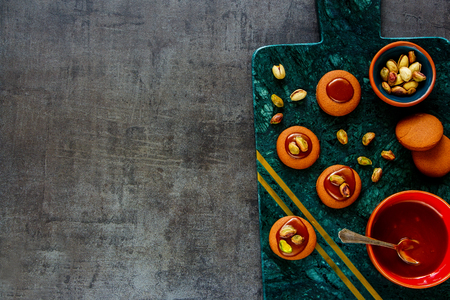 Homemade pishtachios caramel cookies on vintage background flat layの写真素材