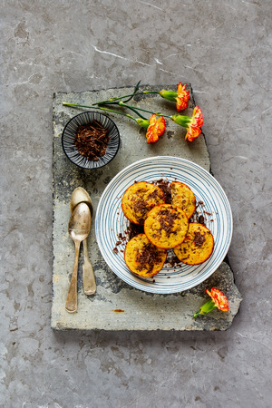 Banana chocolate muffins in plate captured from above, flat layの写真素材
