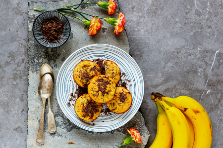 Flat-lay of healthy banana chocolate muffins captured from aboveの写真素材