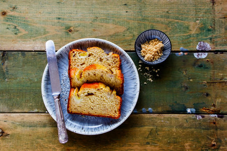 Flat-lay of sliced banana bread cake dessert in plate captured from aboveの写真素材