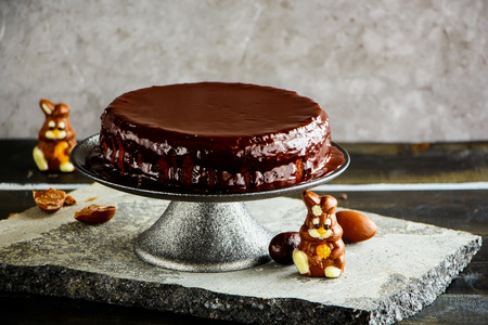 Easter chocolate cake decorated with chocolate bunnies and eggs close upの写真素材