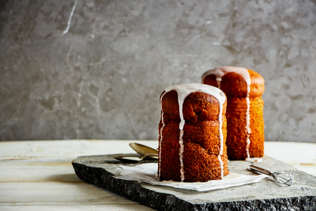 Traditional Easter spring. Easter Cakes - Traditional Kulich, Paska Easter Bread on stone boardの写真素材