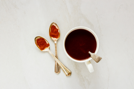 Flat-lay of hot chocolate with spices above over white table. Winter drink.の写真素材