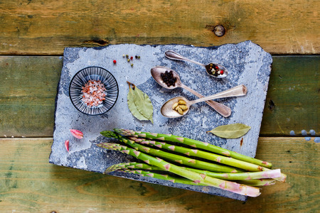Healthy ingredients and spices on stone board flat layの写真素材