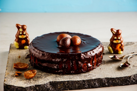 Easter chocolate cake decorated with chocolate eggs and bunniesの写真素材