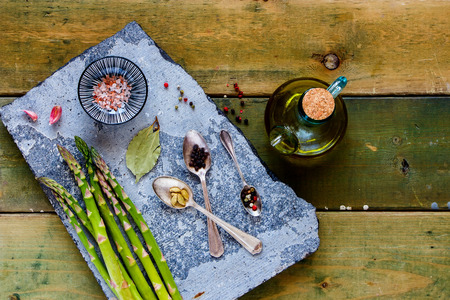 Flat-lay of healthy cooking ingredients on stone board from aboveの写真素材