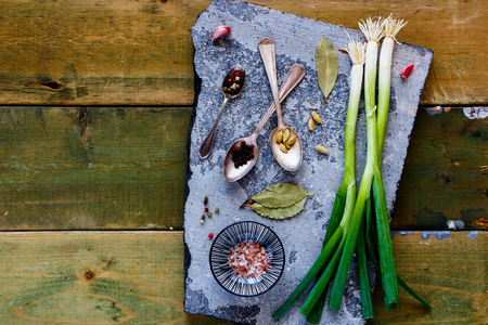 Fresh ingredients and spices on stone board flat layの写真素材