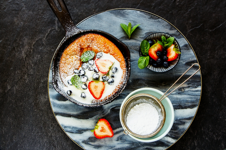 Homemade Danish pancake in frying pan flat lay, Aeblskiver from aboveの写真素材
