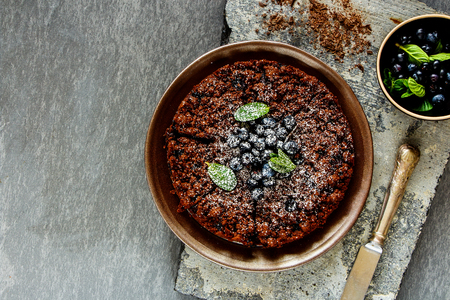 Flat-lay of chocolate blueberry crumble cake captured from aboveの写真素材