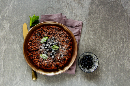 Flat lay of homemade chocolate blueberry crumble cake captured from aboveの写真素材