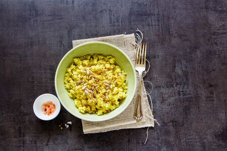 Cauliflower Rice with spices and sunflower seeds on vintage backgroundの写真素材