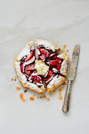 Homemade fruit summer pie flat lay. Plum sweet pieの写真素材