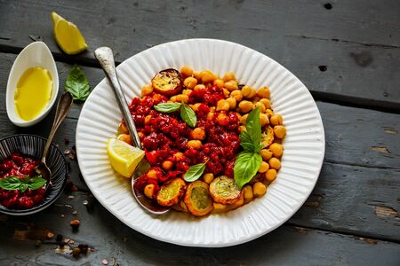 Close up of chick pea salad with zucchini on wooden boardの写真素材